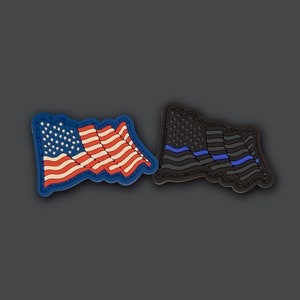 May include: Two embroidered patches, one with an American flag and the other with a thin blue line flag. Both patches are blue and black.