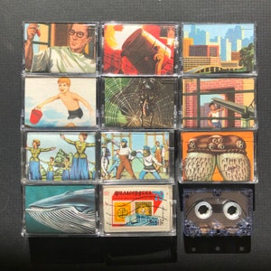 May include: A collection of twelve vintage cassette tapes, each encased in a clear plastic case. The tapes feature various colorful illustrations, including a scientist, a boy with a bucket, a spiderweb, and a whale. The overall theme is retro and artistic.
