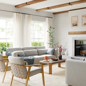 May include: A living room with a white sofa, two woven chairs, a coffee table, and a fireplace with a wood-burning fire. The room has large windows with white curtains and exposed wooden beams on the ceiling.