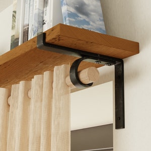 May include: A wooden shelf with black metal brackets and a curtain rod. The shelf is filled with books and the curtain rod is holding up a sheer curtain.