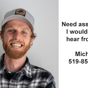 May include: A smiling man wearing a grey plaid shirt and a grey baseball cap with a brown logo that says "CATSPIN". The text "Need assistance? I would love to hear from you. Micha @ 519-852-7536" is on the right side of the image.