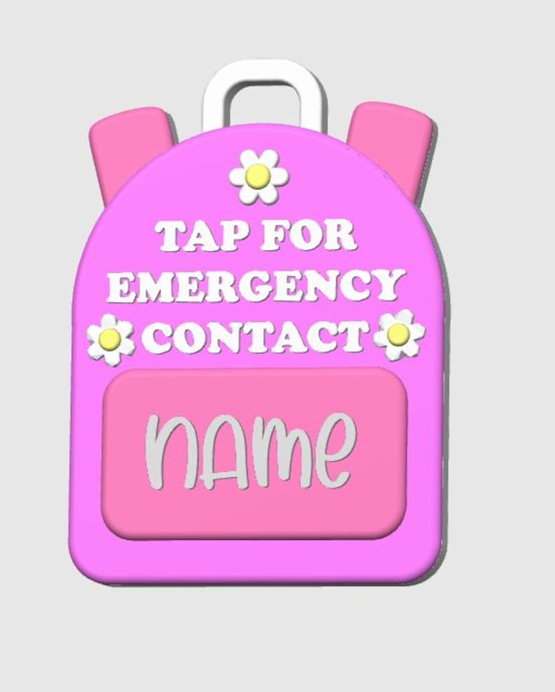 May include: A pink backpack-shaped tag with white text that reads "TAP FOR EMERGENCY CONTACT" and "NAME". The tag has a white handle and two pink side pockets. It is decorated with three yellow and white flower accents.