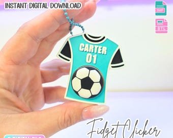 May include: A 3D printed fidget clicker in the shape of a turquoise and black football jersey with the name CARTER and the number 01 printed on the front. A black and white football graphic is centred below the text. Includes a blue ball chain.