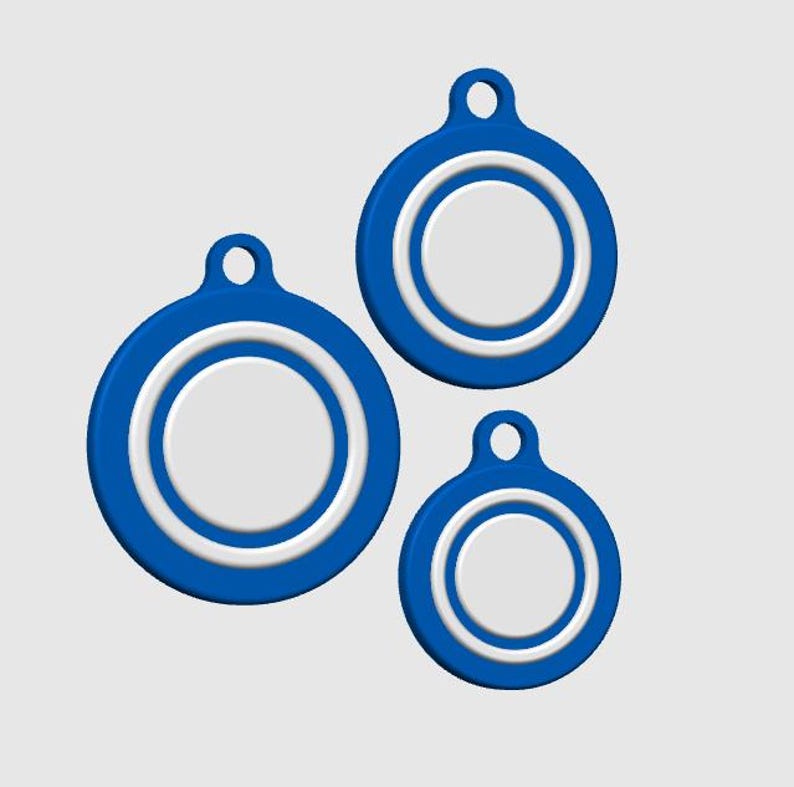May include: Three blue and white circular tags with a hole at the top for attachment. The tags are in varying sizes, with a white inner circle and a blue outer ring. The background is a solid light gray.