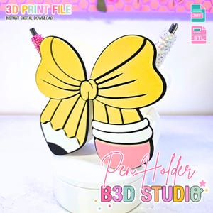 May include: A yellow pencil-shaped pen holder with a bow design. The pen holder has a pink base and a white top. The text "Pen Holder" and "B3D STUDIO" are visible. The image also includes the text "3D PRINT FILE" and "INSTANT DIGITAL DOWNLOAD".