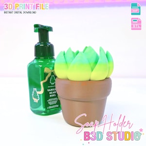 May include: A green soap dispenser beside a brown pot-shaped soap holder with a green and yellow succulent design. The soap dispenser has the text "Vanilla Bean Noel". The image also includes the text "3D PRINT FILE" and "Soap Holder".