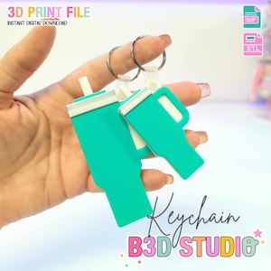 May include: Teal-colored keychain featuring a tumbler design with white accents. The keychain is held by a hand and attached to a silver keyring. Text on the image reads "3D PRINT FILE" and "Keychain B3D STUDIO".