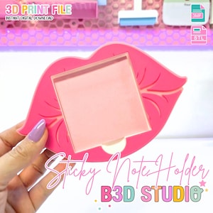 May include: A pink sticky note holder shaped like lips, with a square note area. The holder has the text "Sticky Note Holder" and "B3D STUDIO". The image also includes the text "3D PRINT FILE" and "INSTANT DIGITAL DOWNLOAD".
