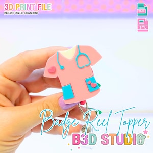 May include: A pink nurse's uniform badge reel topper with a stethoscope, heart accents, and blue pockets. The text "Badge Reel Topper" and "B3D STUDIO" are visible. The image also includes the text "3D PRINT FILE" and "INSTANT DIGITAL DOWNLOAD".