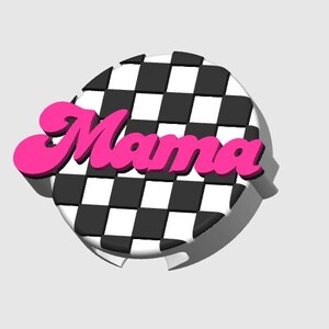 May include: A round, black and white checkered design with the word "Mama" in bright pink, 3D lettering. The design has a white border and a shadow effect, creating a pop-art style.