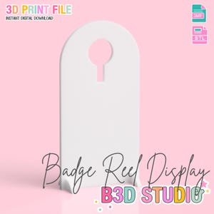 May include: A white badge reel display with a keyhole-shaped opening at the top. The text "3D PRINT FILE" and "INSTANT DIGITAL DOWNLOAD" are at the top. The words "Badge Reel Display" and "B3D STUDIO" are also visible.