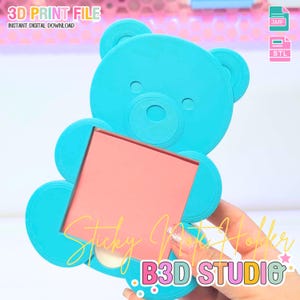 May include: A turquoise 3D-printed bear-shaped sticky note holder. The holder has a rectangular opening for the sticky notes and features the text "Sticky Note Holder" and "B3D STUDIO". The image also includes the text "3D PRINT FILE" and "INSTANT DIGITAL DOWNLOAD".