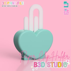 May include: A heart-shaped paper clip holder in a soft teal color with white accents. The holder has a curved handle and two vertical posts. The words "Paper Clip Holder" and "B3D STUDIO" are written on the image. The image also says "3D PRINT FILE" and "INSTANT DIGITAL DOWNLOAD".