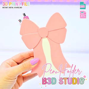 May include: A pink bow-shaped pen holder with a light yellow stripe down the center. The text "Pen Holder" and "B3D STUDIO" are visible. The image also includes the text "3D PRINT FILE" and "INSTANT DIGITAL DOWNLOAD".