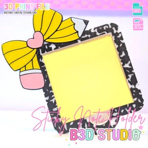 May include: A 3D-printed sticky note holder featuring a pencil and bow design. The holder has a black and white patterned border and a yellow sticky note. Text on the image reads "3D PRINT FILE" and "Sticky Note Holder".