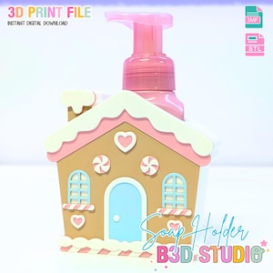 May include: A pink soap dispenser with a gingerbread house-shaped holder. The holder is tan with pink and white accents, featuring a blue door, heart details, and the text "Soap Holder B3D STUDIO". The top reads "3D PRINT FILE INSTANT DIGITAL DOWNLOAD".
