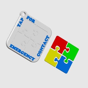 May include: A white puzzle-shaped keychain with blue text that reads "TAP FOR EMERGENCY CONTACT." A separate four-piece puzzle is in red, green, yellow, and blue. The keychain has a hole for attachment.