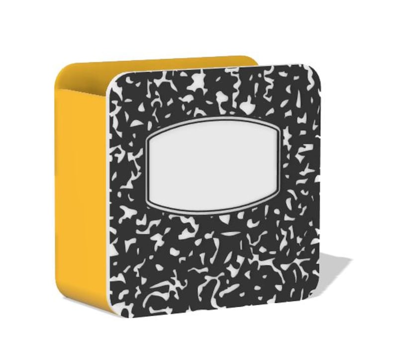 May include: A yellow and black composition notebook-style box. The front of the box has a black and white speckled pattern with a white label area. The sides of the box are solid yellow.