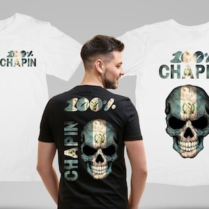 May include: Black t-shirt with a skull design incorporating the Guatemalan flag. The text "100% Chapin" is above the skull. Two white t-shirts with the same design are also visible.
