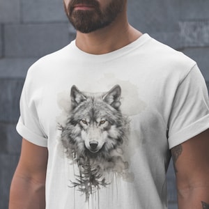 May include: White t-shirt featuring a watercolour design of a wolf's head with a forest background.