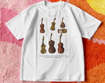 May include: A white short-sleeve t-shirt featuring a graphic print of seven historical string instruments labelled with the text MUSIC, 1. The Violin, 2.3 Rebecs, 4. The Crouth, 5. The Viol d'Amore, 6. The Vioncello, 7. Viol di Gamba.