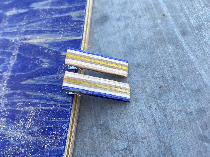 Blue and Yellow Alligator Hair Clips Made From Recycled Skateboard