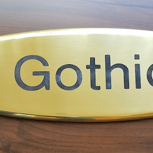Engraved glossy brass oval nameplates