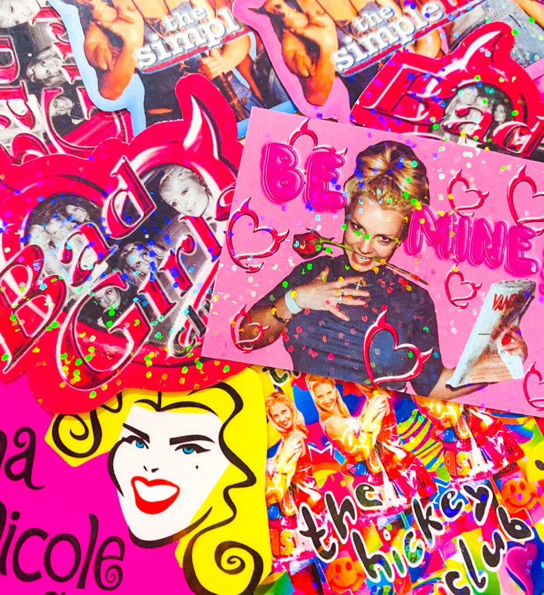 May include: A colourful collage of stickers and cards with a pop art style. The designs feature images of a woman, hearts, and text including "Be Mine" and "the hockey club". The colour palette includes pink, red, yellow, and blue.