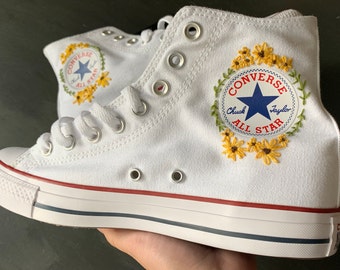 white converse with sunflowers