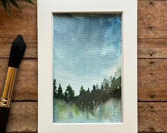 Misty trees reflecting in a lake | Impressionist forest lake scene | Blue green watercolor decor | “The Mist-erious Forest”