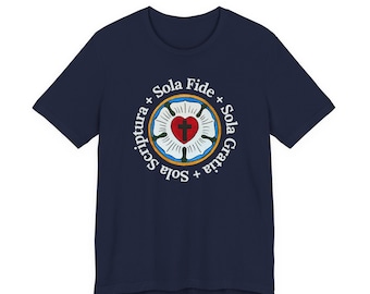 May include: A navy blue short-sleeve t-shirt featuring a circular Luther Rose emblem in the center. The design includes a red heart with a black cross, surrounded by white petals and a gold ring. The text Sola Fide, Sola Gratia, and Sola Scriptura is printed in white around the emblem.