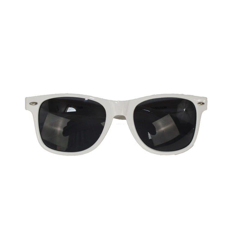 May include: White plastic sunglasses with black lenses.