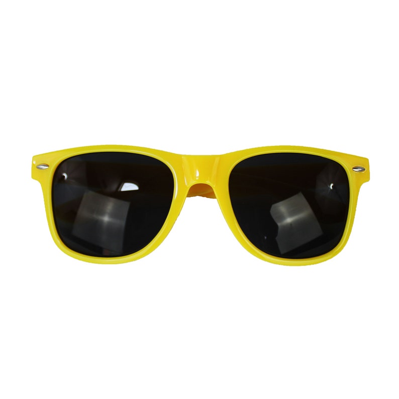 May include: Yellow plastic sunglasses with black lenses.