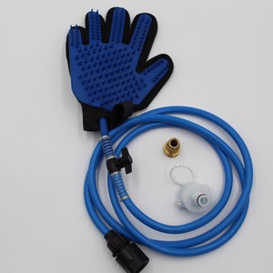 May include: A blue pet grooming glove with rubber bristles, connected to a blue hose with a black connector. Additional components include a brass fitting and a white plastic piece. The items are designed for pet care.