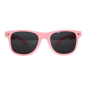 May include: Pink plastic sunglasses with dark lenses.