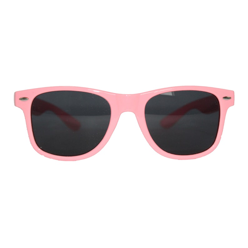 May include: Pink plastic sunglasses with dark lenses.