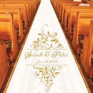 May include: White aisle runner with a gold floral design and the text "Sarah & Peter June 14, 2028".