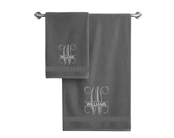 May include: Two gray bath towels with a monogrammed "W" and the name "Williams" embroidered in white.