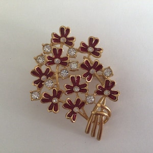 Vintage Brooch.Gorgeous Bunch of flowers.Gold tone,Red enamel,rhinestones clear crystal.Made in 1970’s.Unmarked.Excellent Vintage Condition.