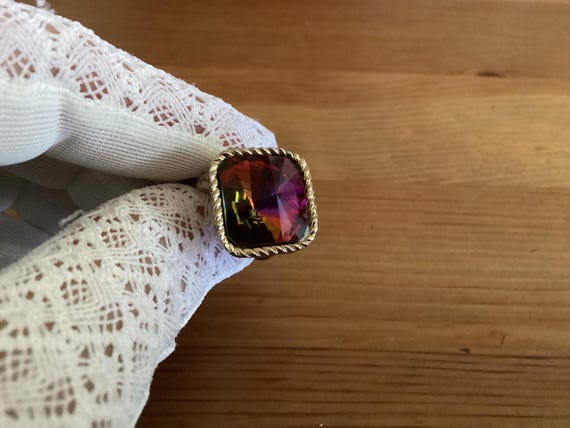 This ring features a large, iridescent "mystic to… - image 8