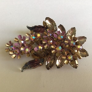 Vintage Brooch.Unmarked.Bronze color.Rhinestone Austria Crystal AB.Made in 1960’s.Excellent Vintage Condition.