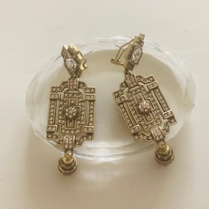 Brincos de cristal e vidro cor bronze Heidi Daus “Classic Edition” vintage