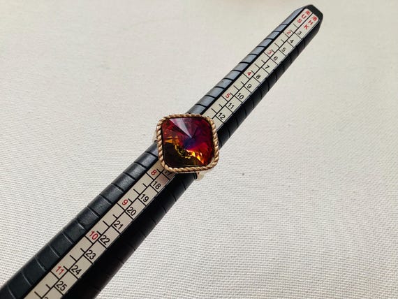 This ring features a large, iridescent "mystic to… - image 6