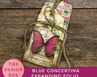 May include: A blue concertina expanding folio with a floral design and a pink butterfly embellishment. The folio is tied with twine and has a vintage aesthetic.