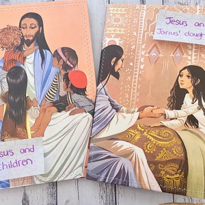 May include: Two illustrated children's books with covers depicting scenes from the Bible. The first book shows Jesus with children, and the second book shows Jesus healing a young girl. The text on the covers reads "Jesus and children" and "Jesus and Jarius' daughter".
