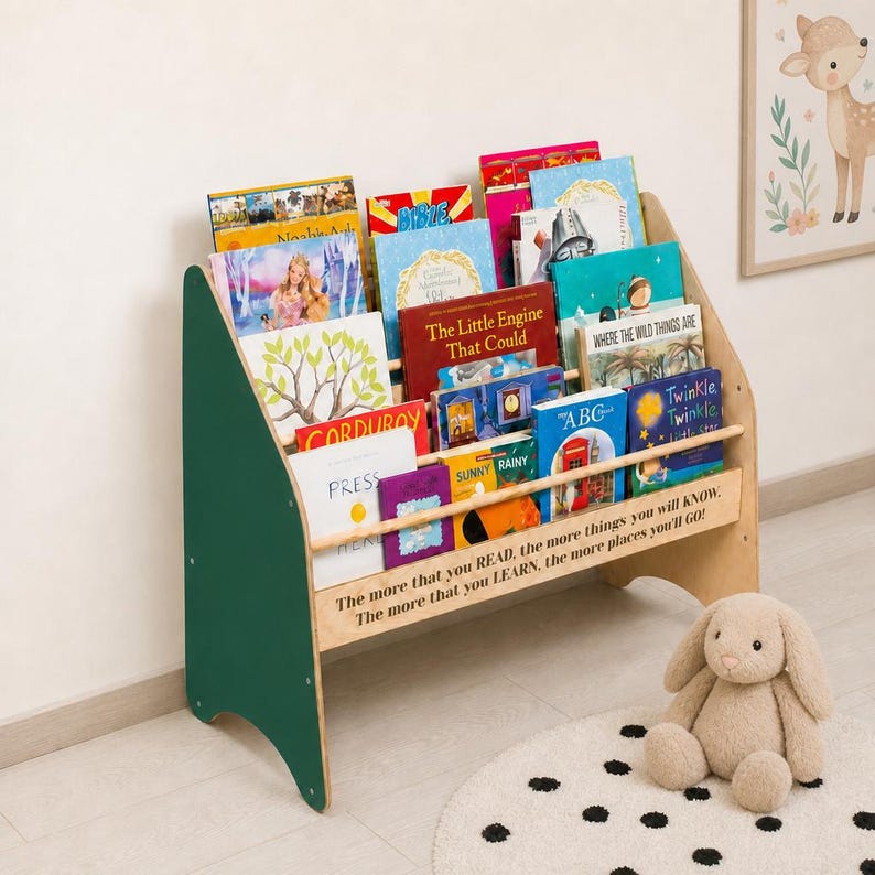 May include: A wooden children's bookshelf with dark green side panels and natural wood shelves. The front features the text: The more that you READ, the more things you will KNOW. The more that you LEARN, the more places you'll GO!