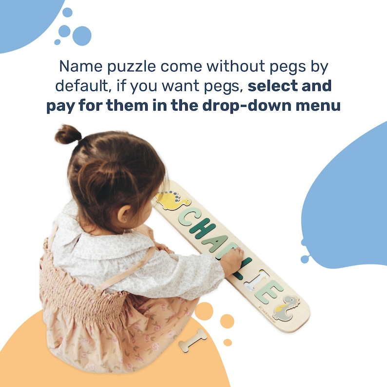 May include: A wooden name puzzle with the name "CHARLIE" in green letters. The puzzle is light-colored with dinosaur illustrations. The text above the puzzle reads: "Name puzzle come without pegs by default, if you want pegs, select and pay for them in the drop-down menu."