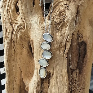 Women's silver and white mother-of-pearl chain and "bubbles" pendant necklace.