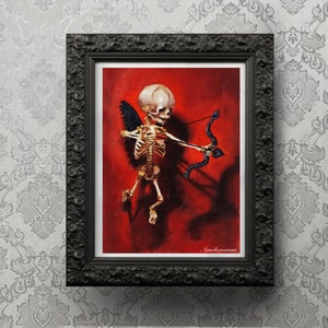 May include: A skeletal cherub with black wings holds a bow and arrow, painted on a red background. The artwork is framed in black.