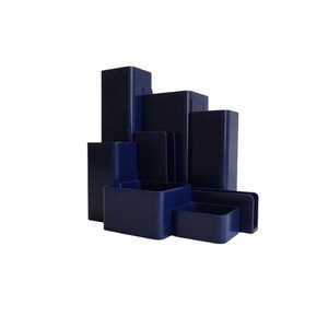 May include: A navy blue desktop organiser with multiple compartments for pens, pencils, and other office supplies.
